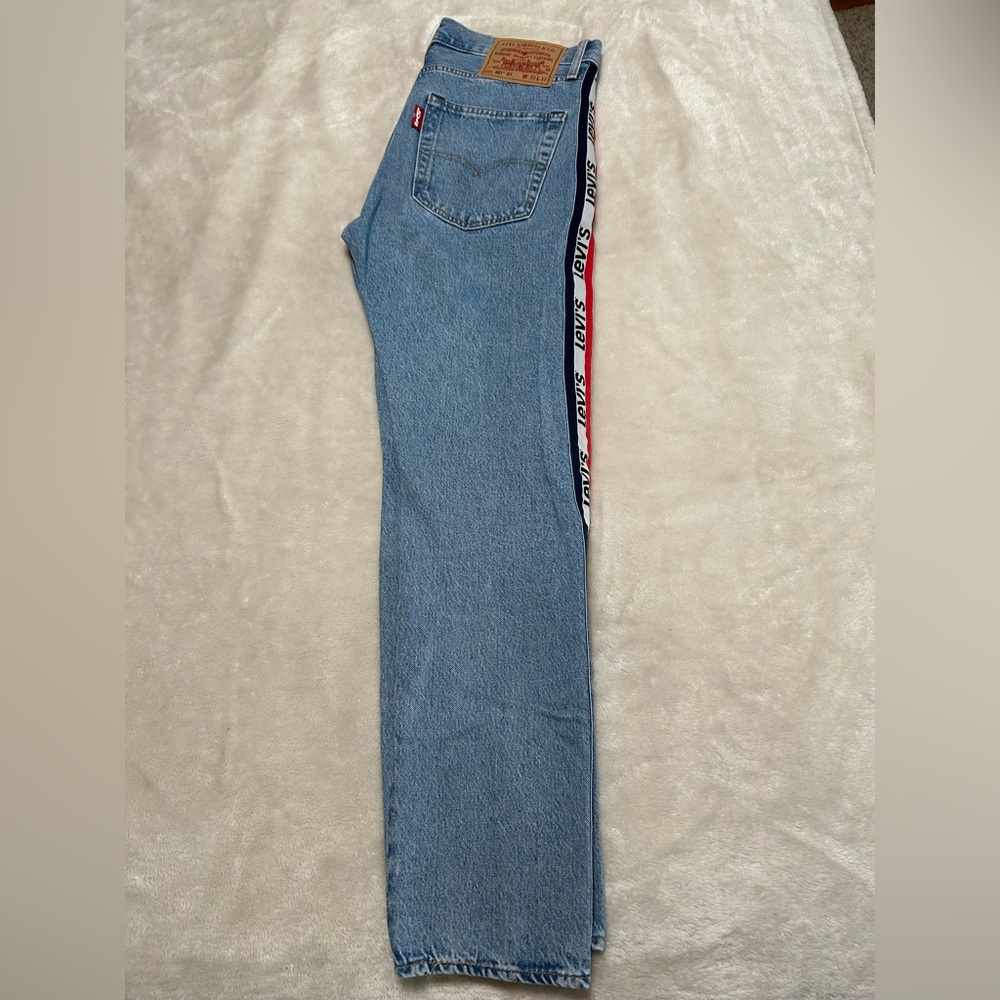 Levi Strauss & CO Logo Jeans
501 style with branding on sides of pant legs.